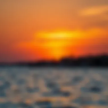 A vibrant sunset over the waters of بطين Beach
