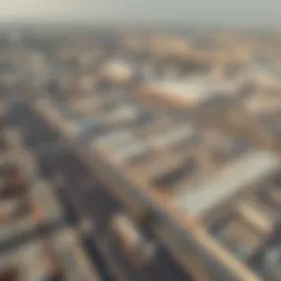 Aerial view showcasing the sprawling industrial landscape of Al Quoz, highlighting warehouse facilities.