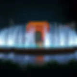A panoramic view of the Dubai Fountain illuminated at night