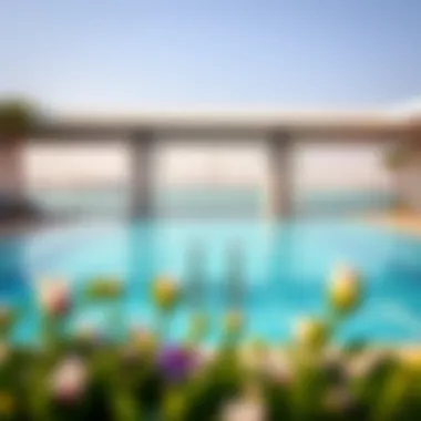 A serene hotel pool area with views of the bridges