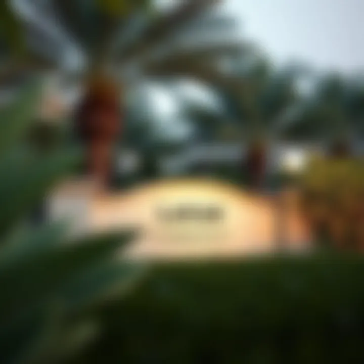 Entrance sign of Layan community surrounded by lush greenery