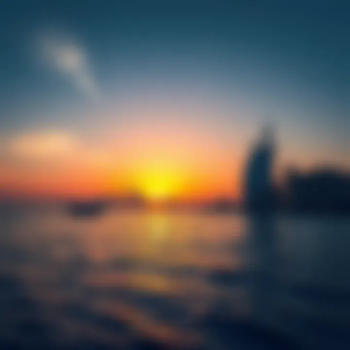 Beautiful sunset over the Arabian Gulf with silhouettes of iconic buildings